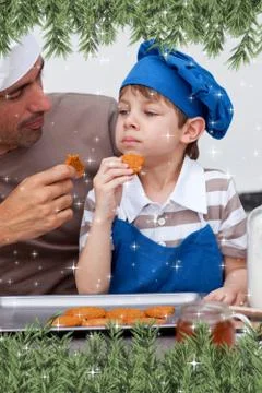 Composite image of father and son eating cookies Stock Illustration