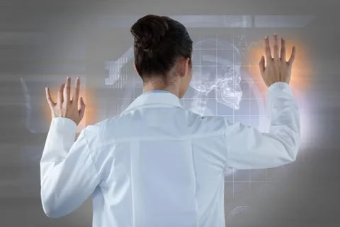 Composite image of female doctor using digital screen against white background Stock Photos