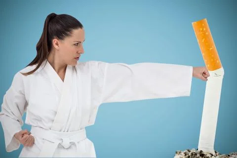 Composite image of fighter performing karate stance Stock Photos