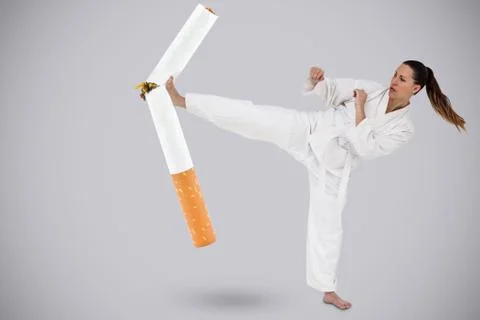 Composite image of fighter performing karate stance Stock Photos