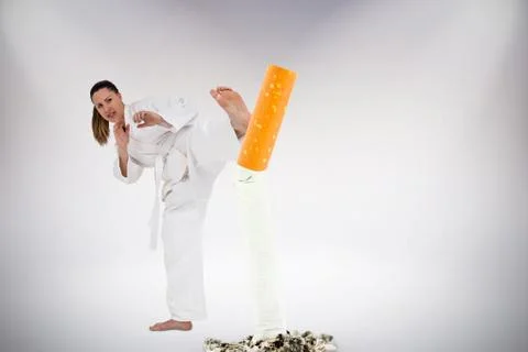 Composite image of fighter performing karate stance Stock Photos