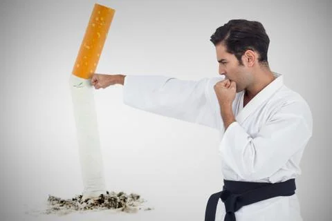 Composite image of fighter performing karate stance Stock Photos