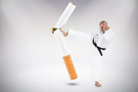 Composite image of fighter performing karate stance Stock Photos