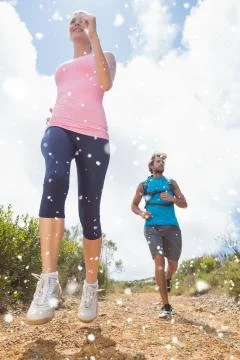 Composite image of fit attractive couple jogging down mountain trail Stock Illustration