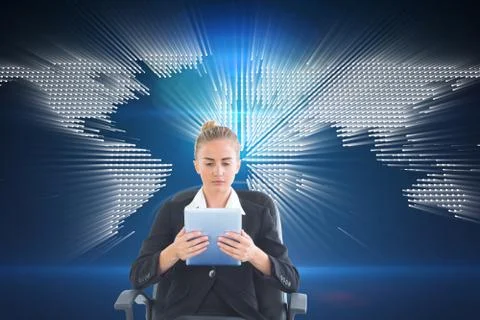 Composite image of front view of concentrated chic businesswoman using her Stock Photos