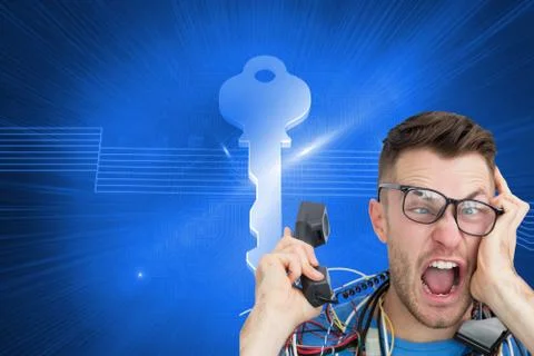 Composite image of frustrated computer engineer screaming while on call in front Illustrazione stock