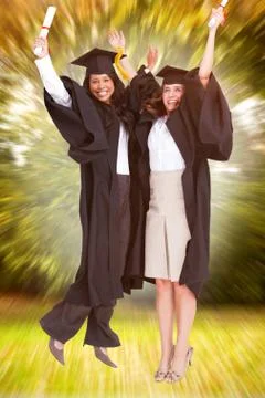Composite image of full length of two women celebrating in the air Fotos Stock