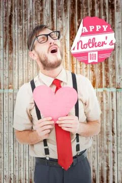 Composite image of geeky hipster crying and holding heart card Stock Illustration