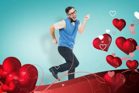 Composite image of geeky hipster dancing and smiling Stock Photos