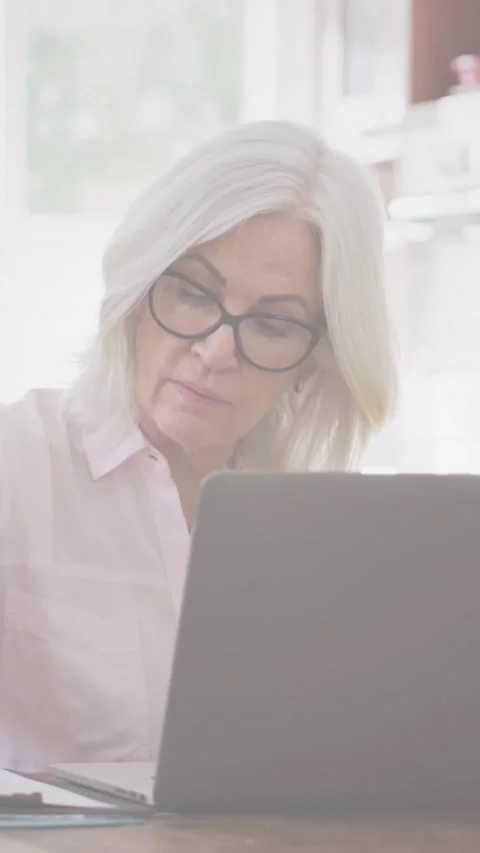 Composite image of globe of digital icons against caucasian senior woman Stock Footage 341953068