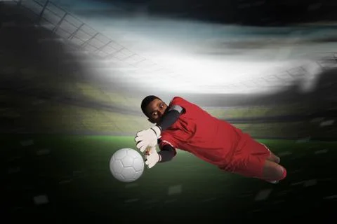 Composite image of goalkeeper in red making a save Stock Illustration