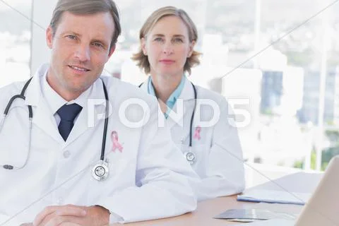 Download A Group Of Doctors Posing For A Photo | Wallpapers.com