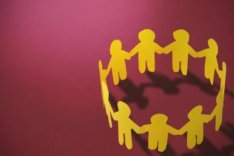 Composite image of  group of yellow little person holding hands Free Stock Illustration