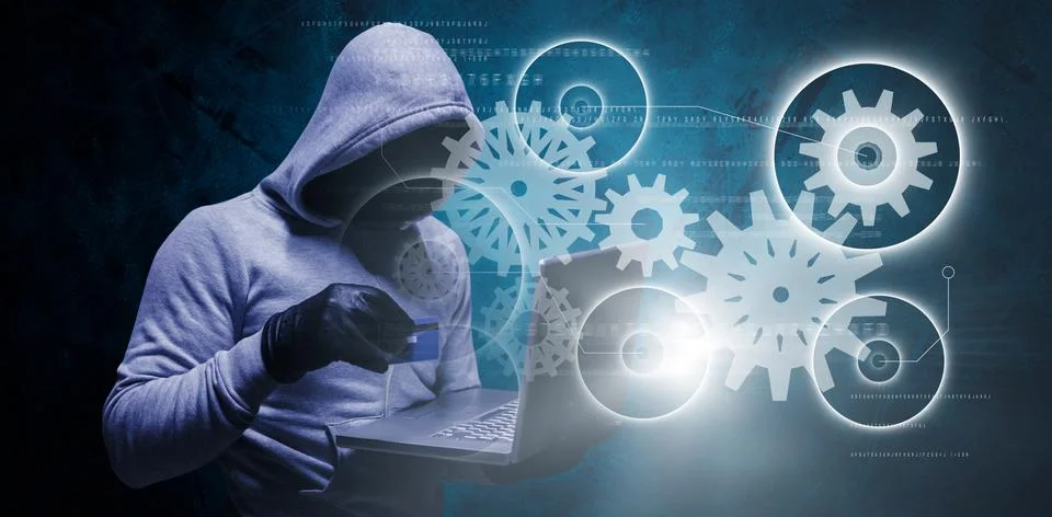 Composite image of hacker using credit card for cyber crime 写真素材