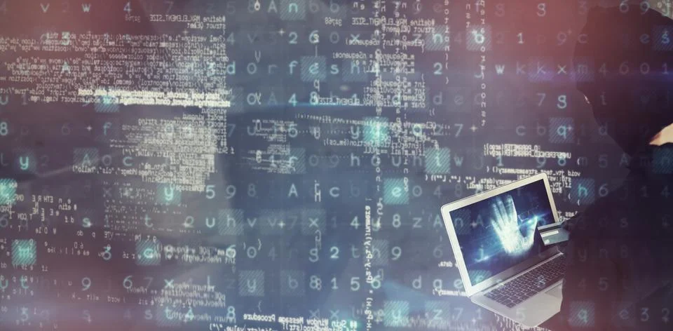 Composite image of hacker using laptop and debit card Stock Photos