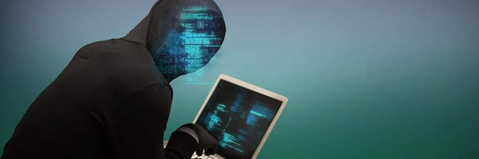 Composite image of hacker using laptop 库存照片
