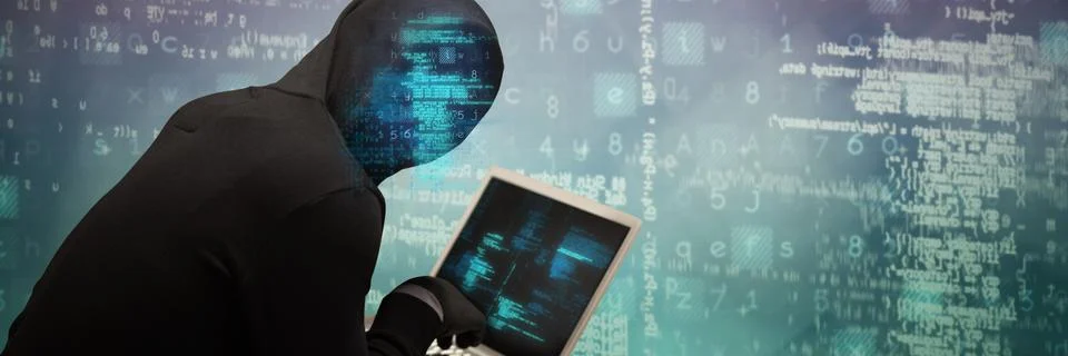 Composite image of hacker using laptop Foto stock