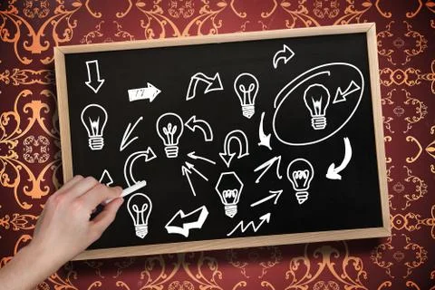 Composite image of hand drawing light bulbs with chalk Stock Illustration