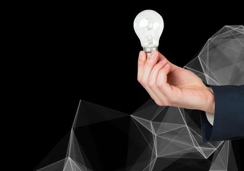 Composite image of Hand Holding Lightbulb against black background 스톡 사진