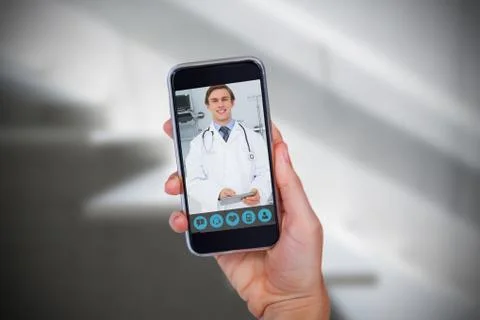 Composite image of hand holding mobile phone against white background Stock Photos