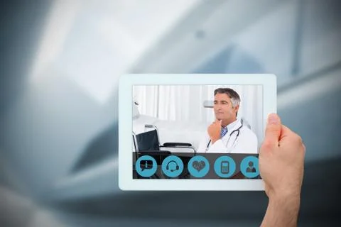 Composite image of hand holding tablet pc Stock Photos