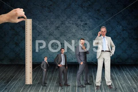 Composite image of hand measuring stages of businessmans life with ...