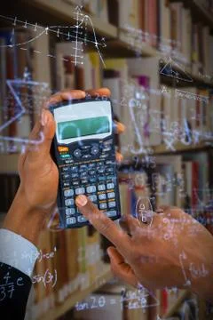 Composite image of hands of businessman using calculator 스톡 사진