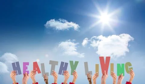 Composite image of hands holding up healthy living Ilustração Stock