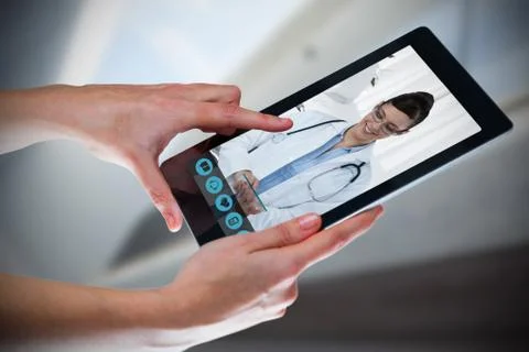 Composite image of hands using digital tablet against white background Stock Photos