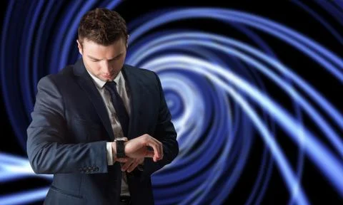 Composite image of handsome businessman checking the time Stock Photos