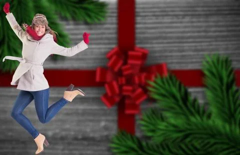 Composite image of happy blonde in winter clothes posing Illustrazione stock