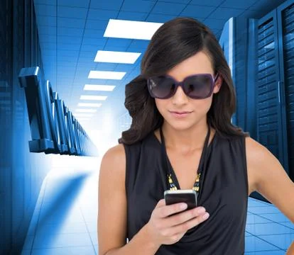 Composite image of happy brunette using smartphone Illustrazione stock