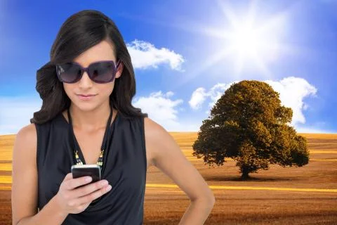 Composite image of happy brunette using smartphone Stock Illustration