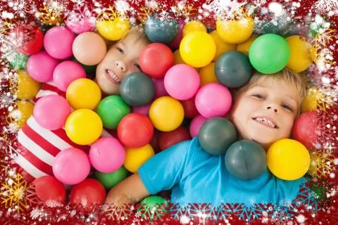 Composite image of happy children playing in ball pool Stock Illustration