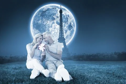 Composite image of happy couple sitting and holding present Stock Illustration