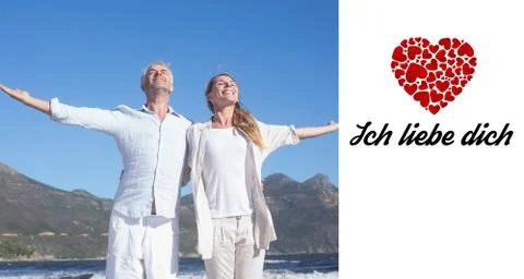 Composite image of happy couple standing with arms outstretched at the beach Ilustración de archivo