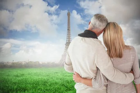 Composite image of happy couple standing with arms around Stock Illustration