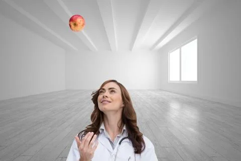 Composite image of happy doctor throwing apple Stock-Illustration