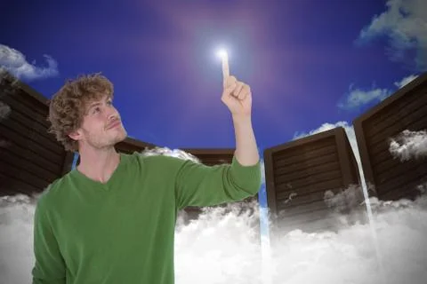 Composite image of happy handsome man pointing something Stock-Fotos