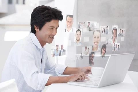 Composite image of happy man using laptop while having a coffee Illustrazione stock