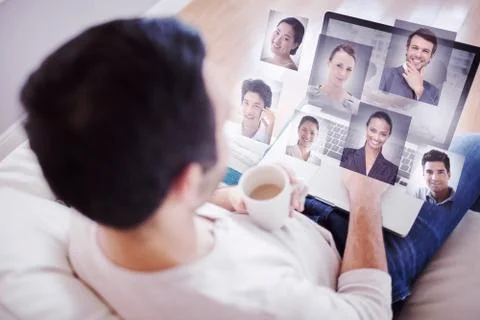Composite image of high angle view of young man using his laptop Stock Illustration