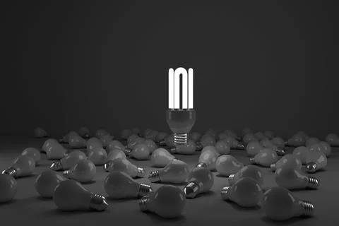 Composite image of lit energy efficient lightbulb over bulbs Illustrazione stock