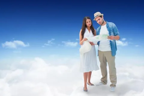 Composite image of lost hipster couple looking at map Ilustração Stock