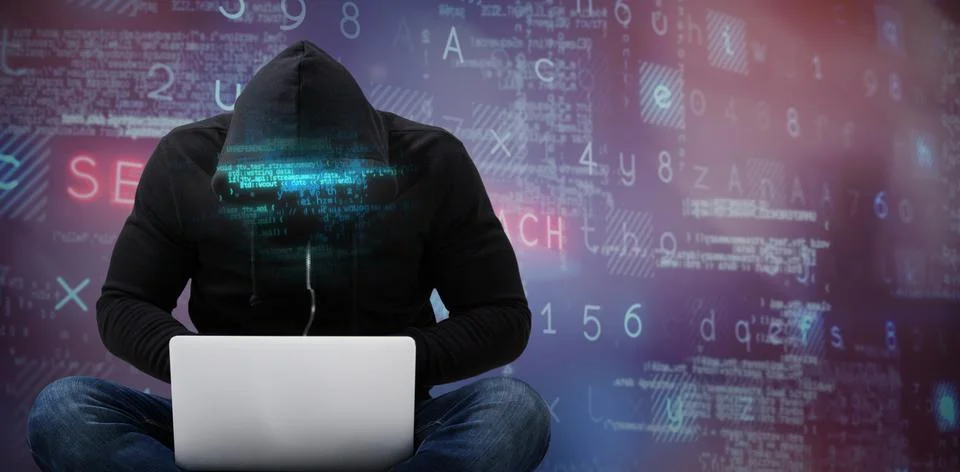 Composite image of male hacker using laptop 스톡 사진