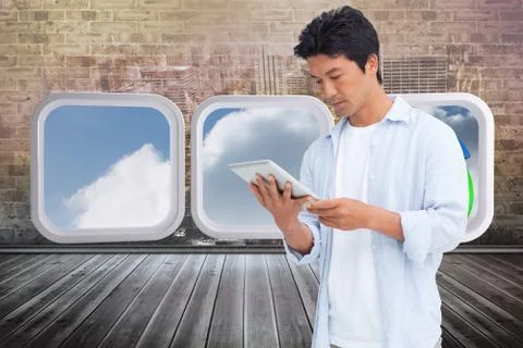 Composite image of male looking at his tablet computer イラスト素材