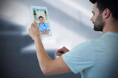 Composite image of man holding digital tablet Stock Photos