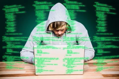 Composite image of  man in hood jacket hacking a laptop Stock Photos