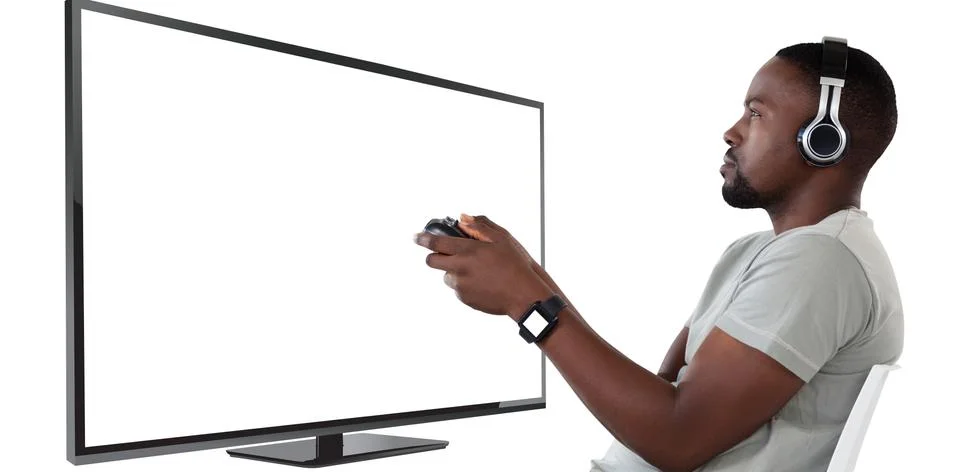 Composite image of man playing video game against white background Stock Photos