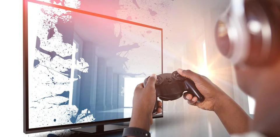 Composite image of man playing video game against white background Foto stock