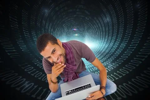 Composite image of man sitting on floor using laptop and smiling at camera 스톡 일러스트